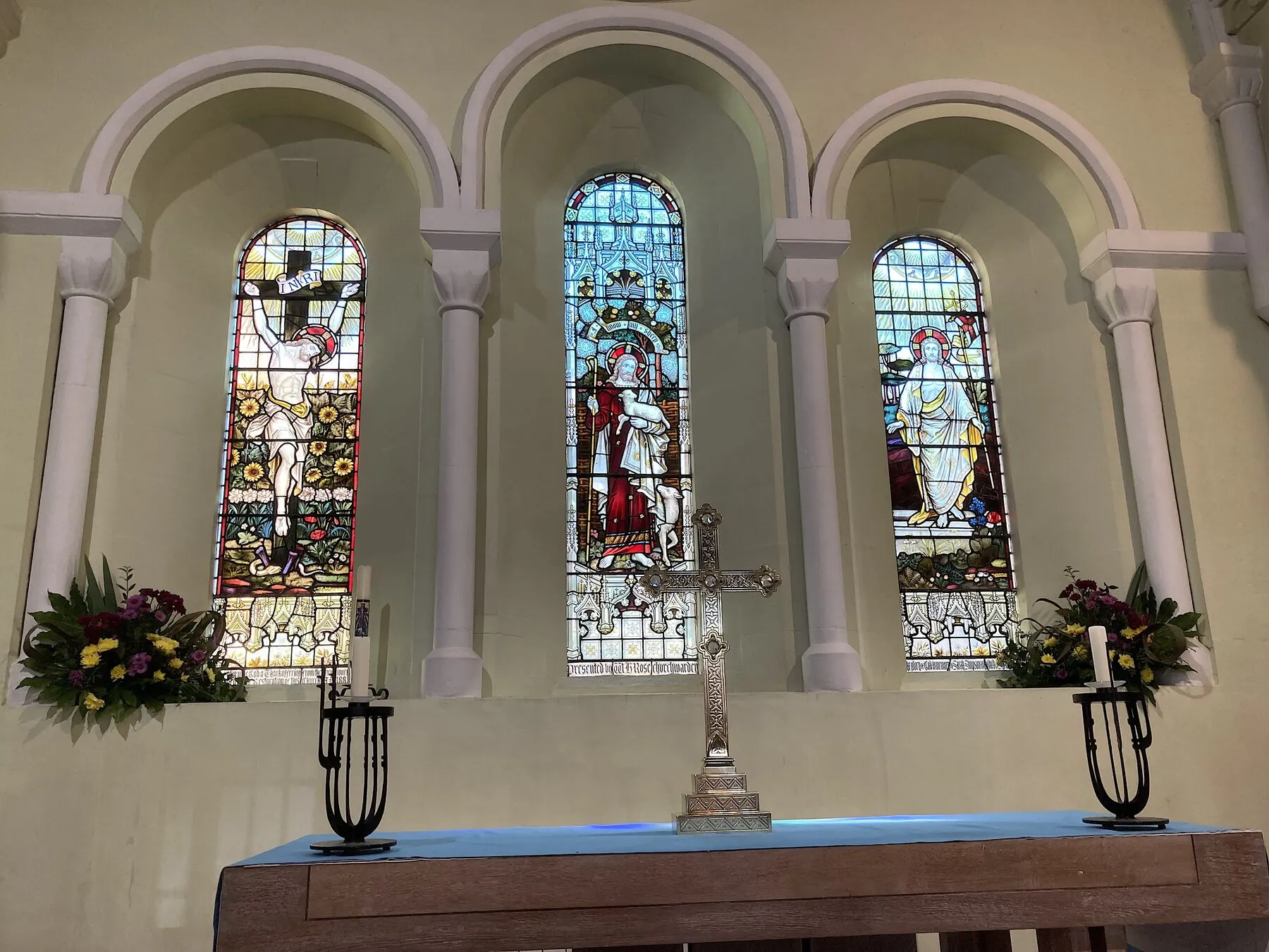 The three stained-glass east windows of St Michael's, above the altar